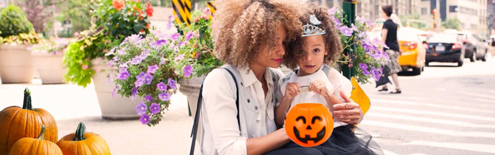Mother and child celebrate halloween.